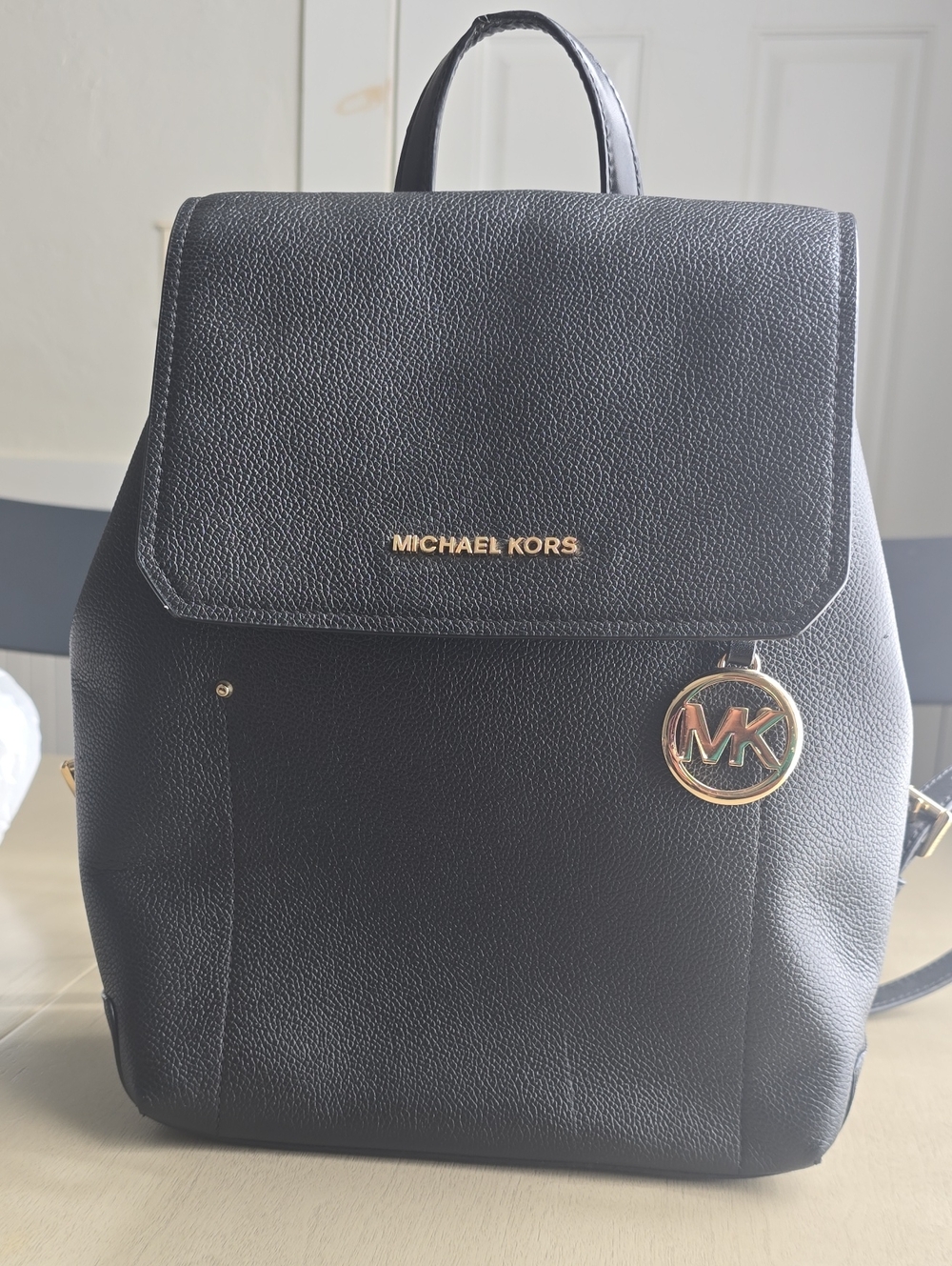 MICHAEL KORS Black Pebbled Leather Backpack with Gold MK Charm